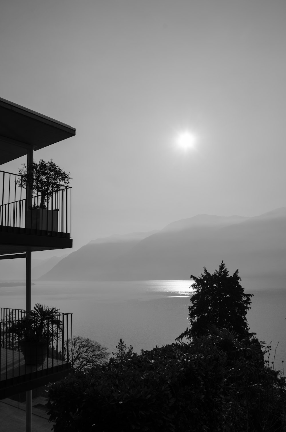 a building with a body of water in the background