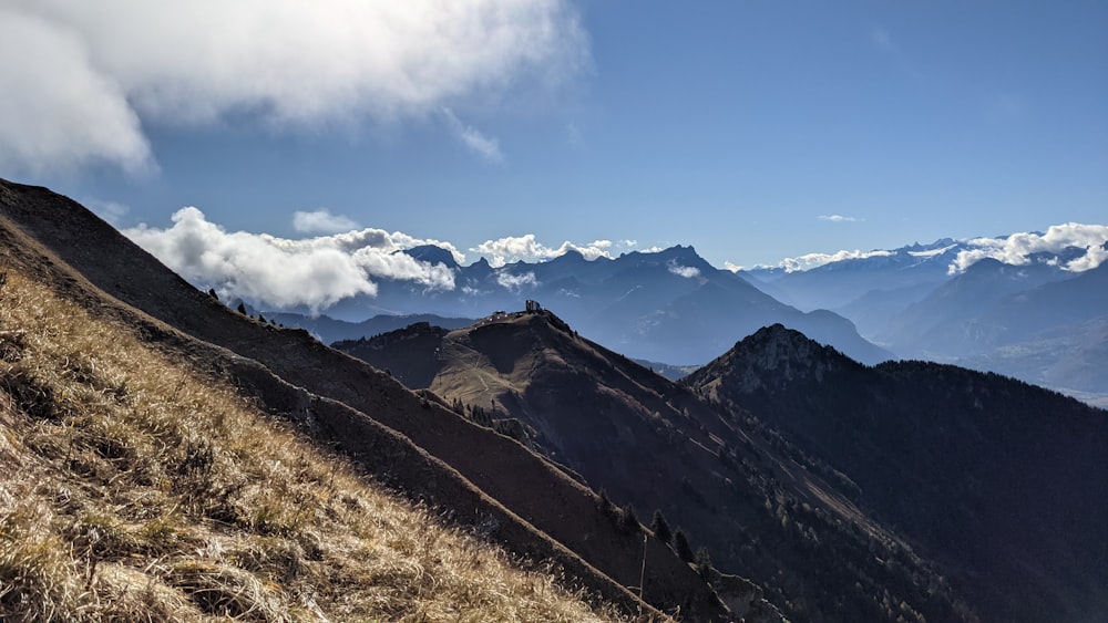 a mountain range with clouds