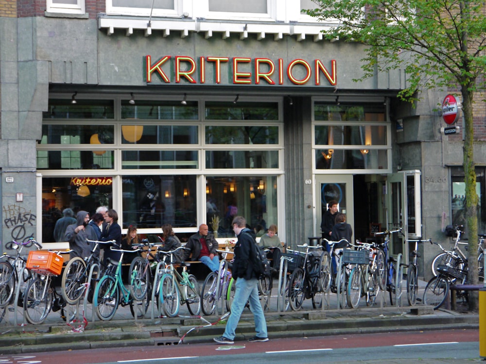 a group of people stand outside a store