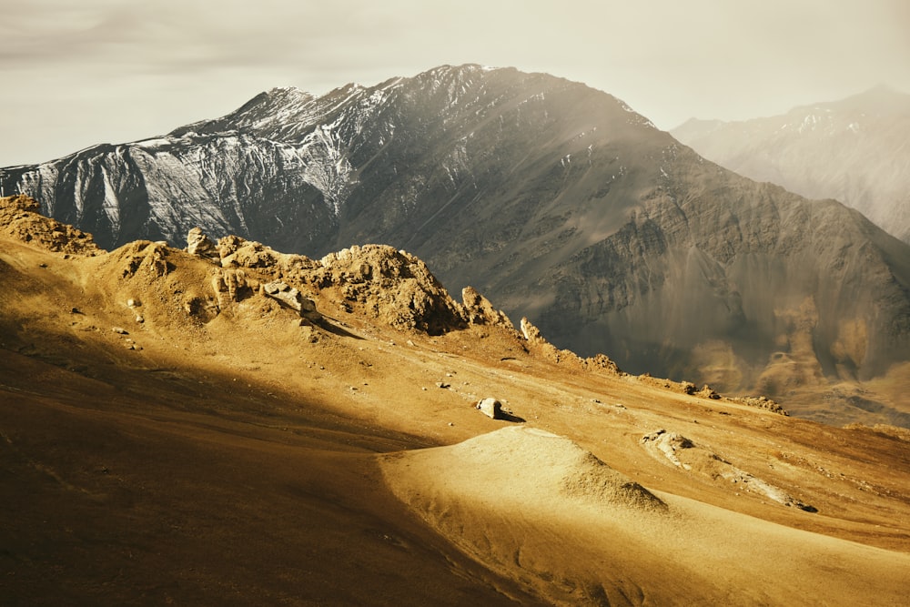 a rocky mountain with snow