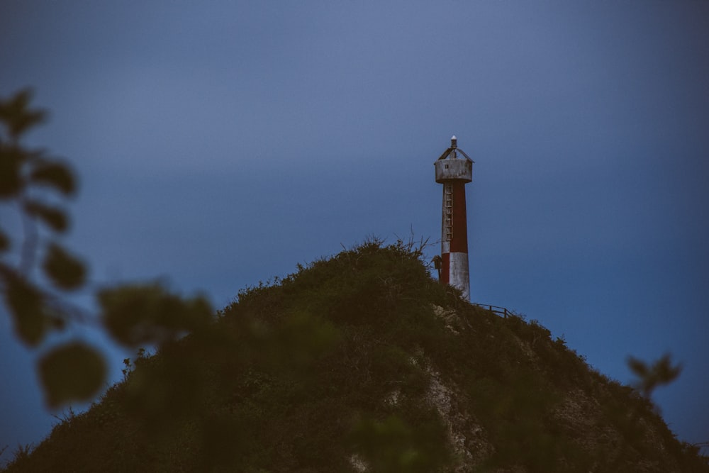 a lighthouse on a hill