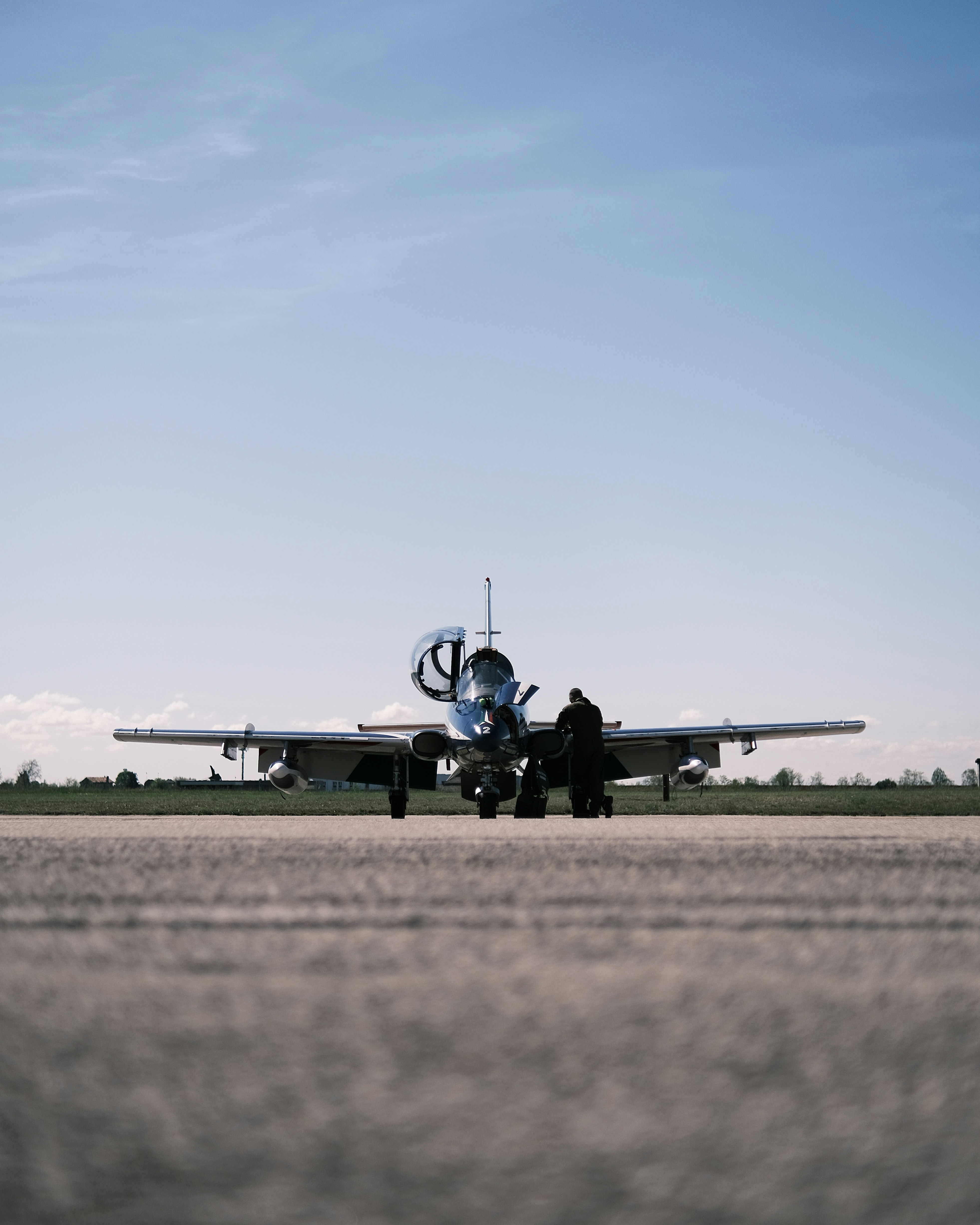 a person standing next to an airplane