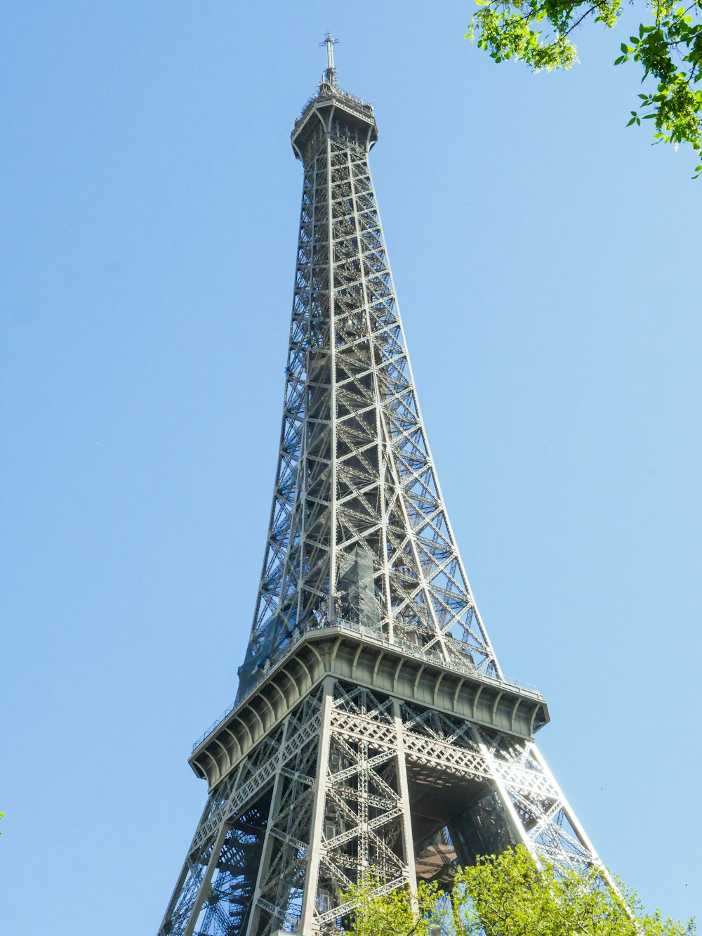 a tall metal tower with Yokohama Marine Tower in the background