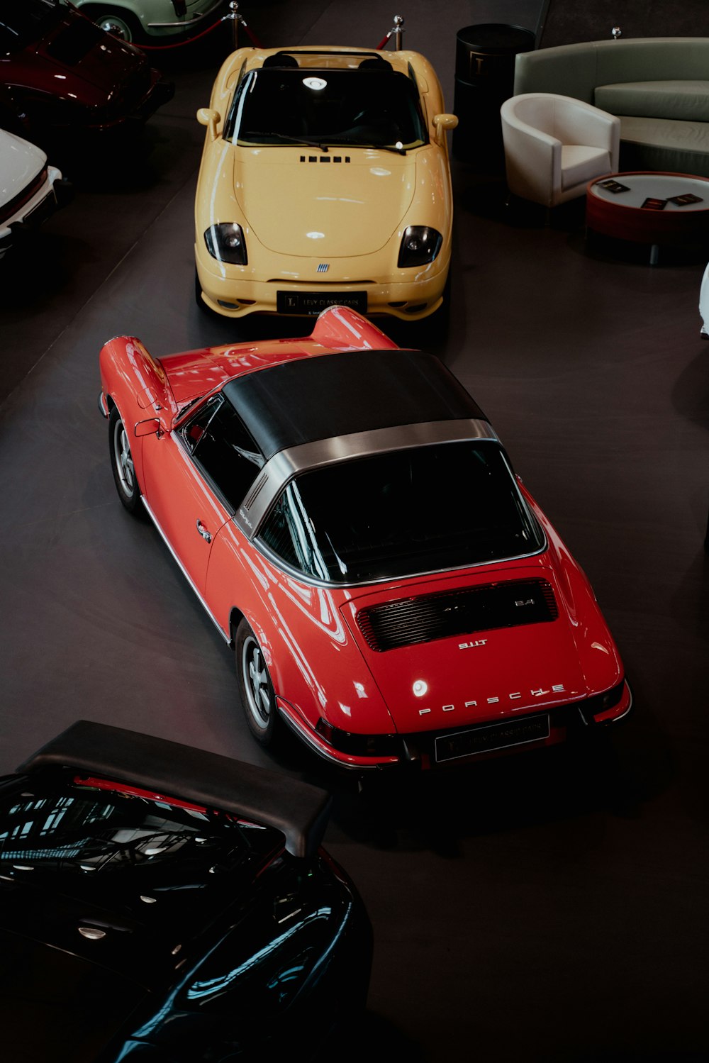 a group of cars parked in a room