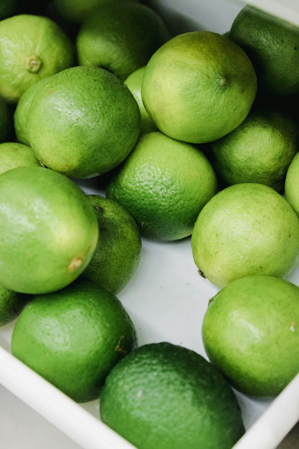 a bowl of green fruit