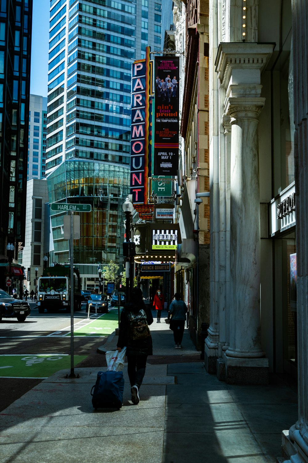 people walking on a sidewalk