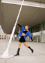 Model striking a dynamic pose in Rawvolt streetwear on downtown city streets.