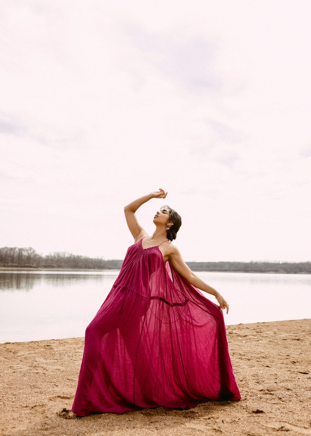 a person in a dress on a beach