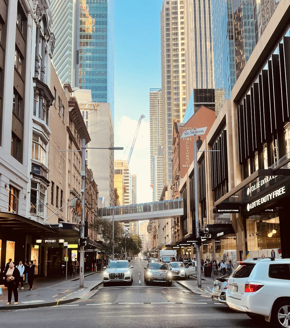 a city street with cars and people