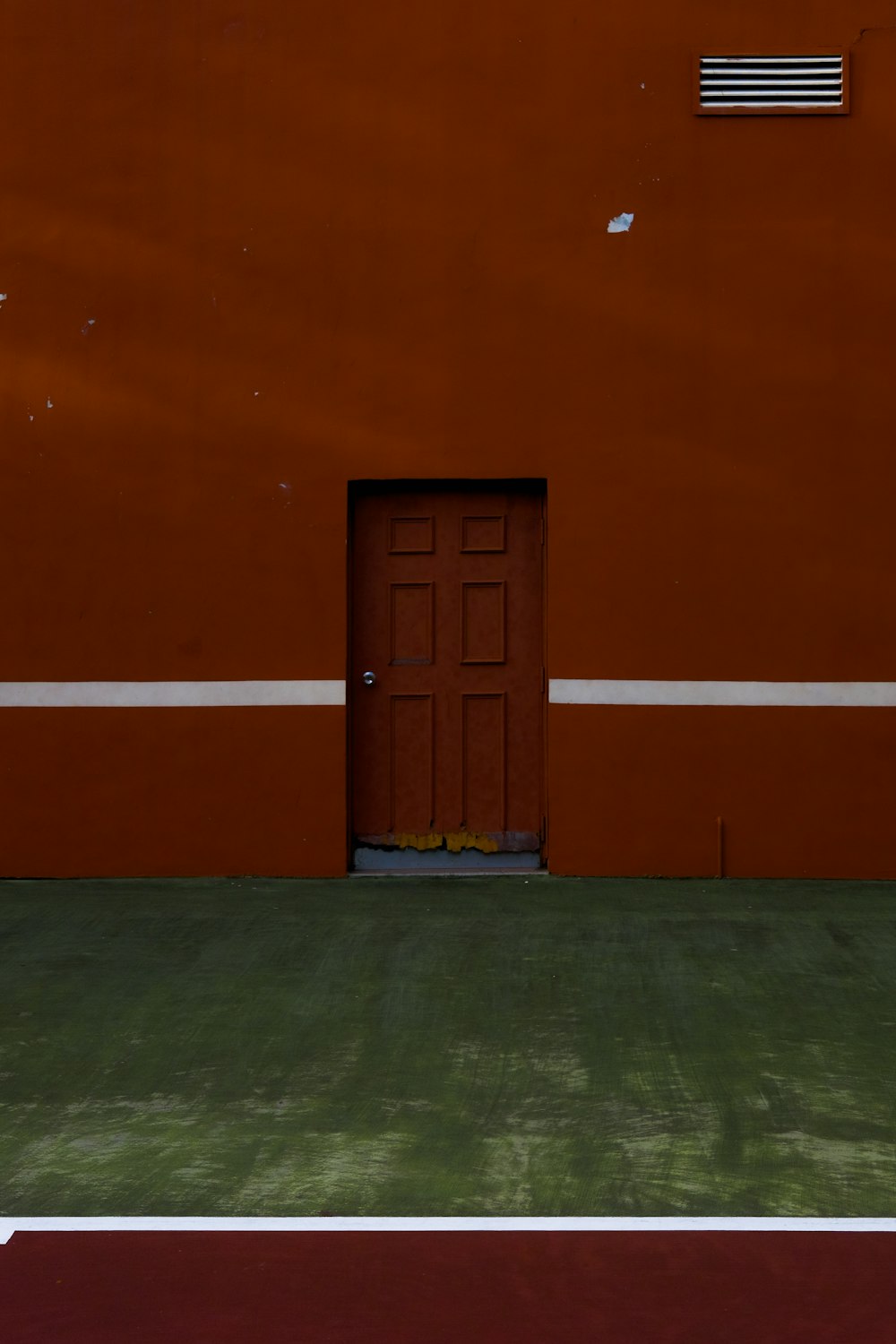 a door in an orange wall