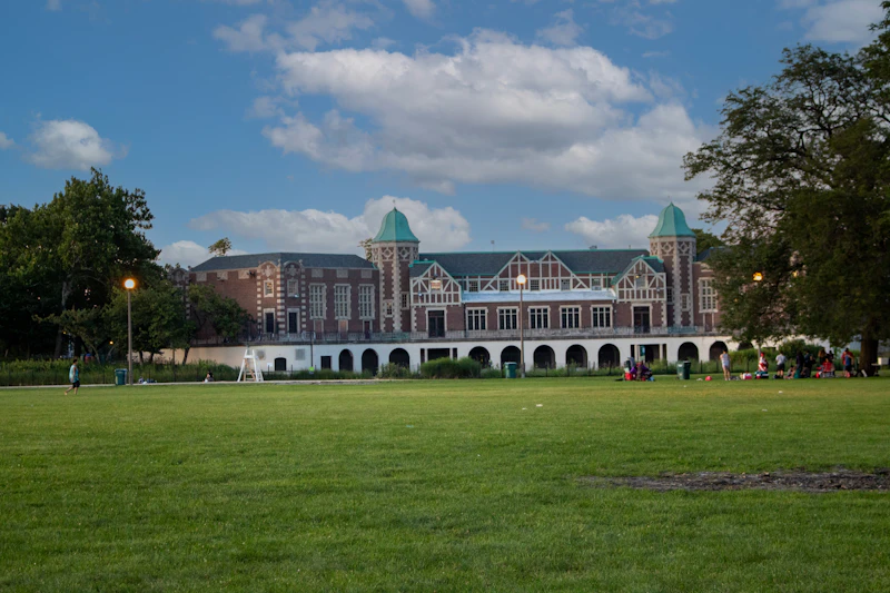 The boat house building with a lawn in front, at Humboldt Park, Chicago