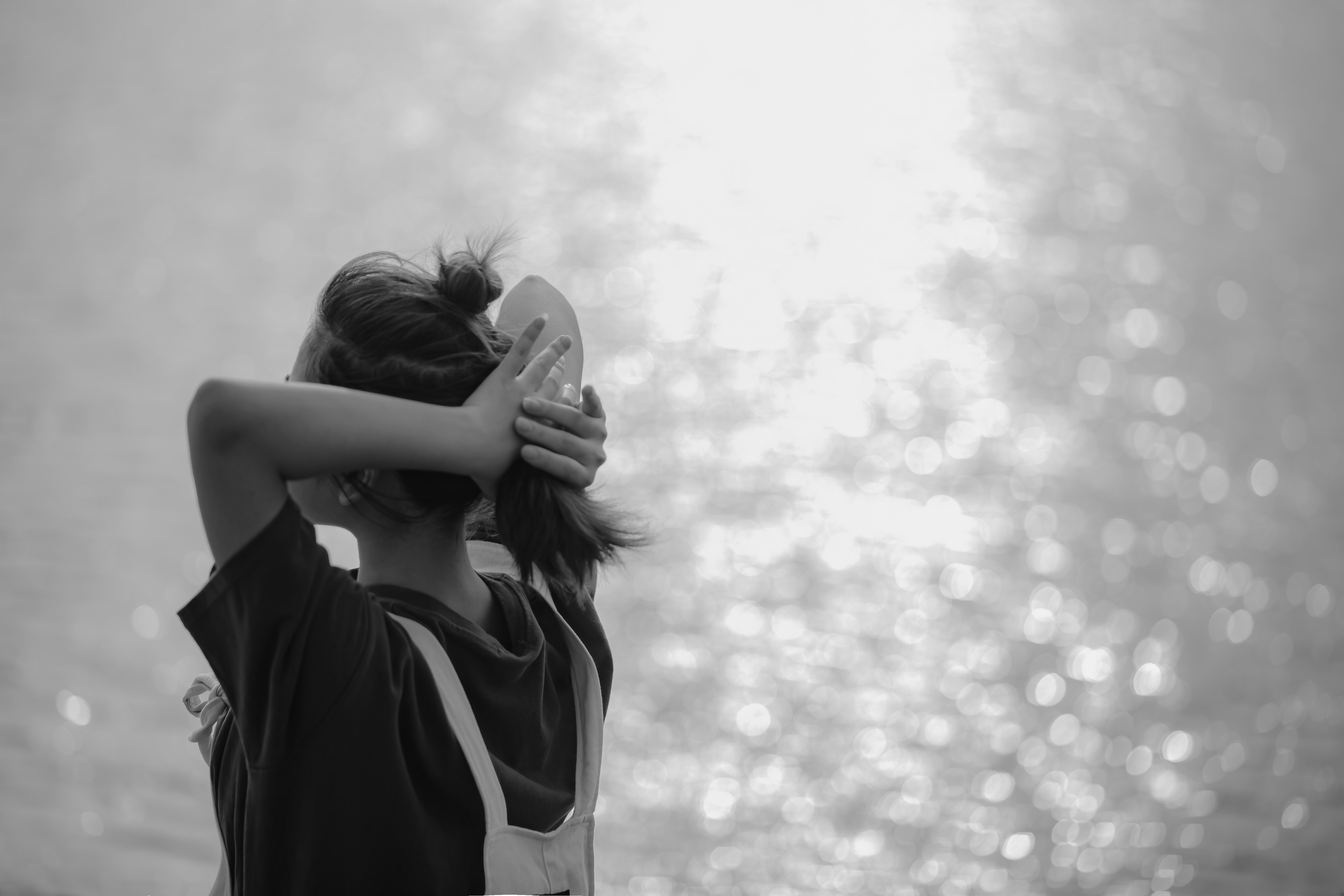 a woman taking a picture of a window