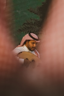 Traditional musicians playing oud and darbuka at a cultural festival.