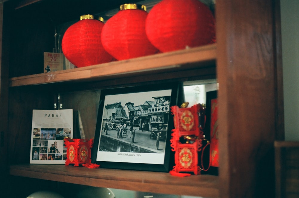 a shelf with red and white balloons