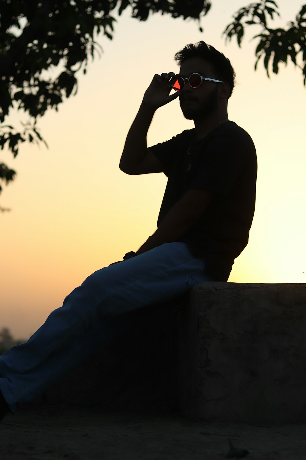 a man sitting on a ledge