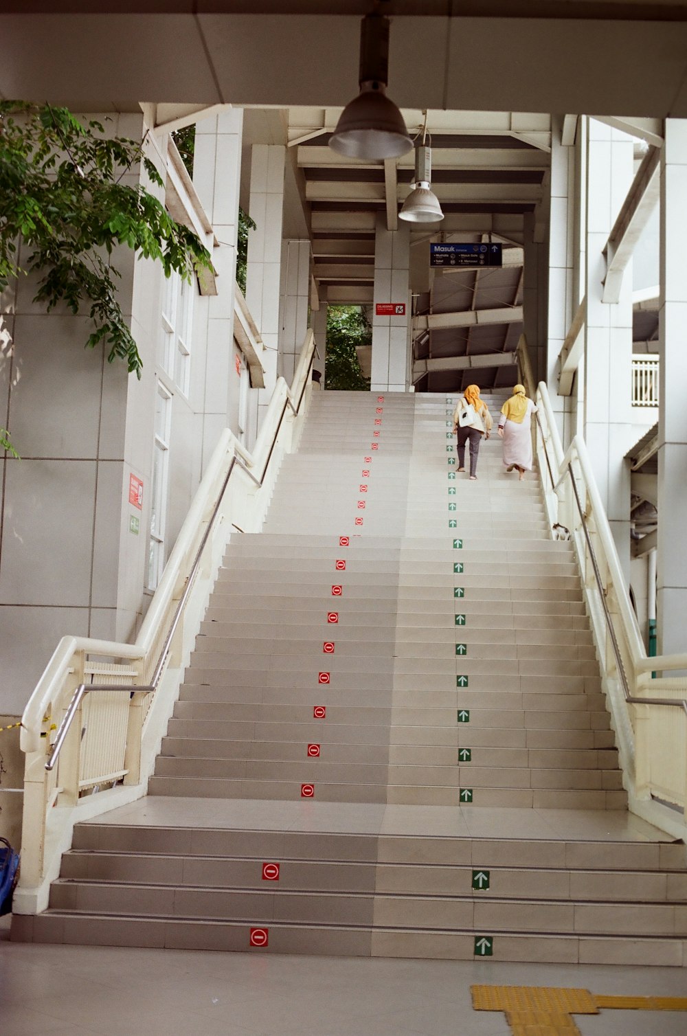a long staircase with people walking on it