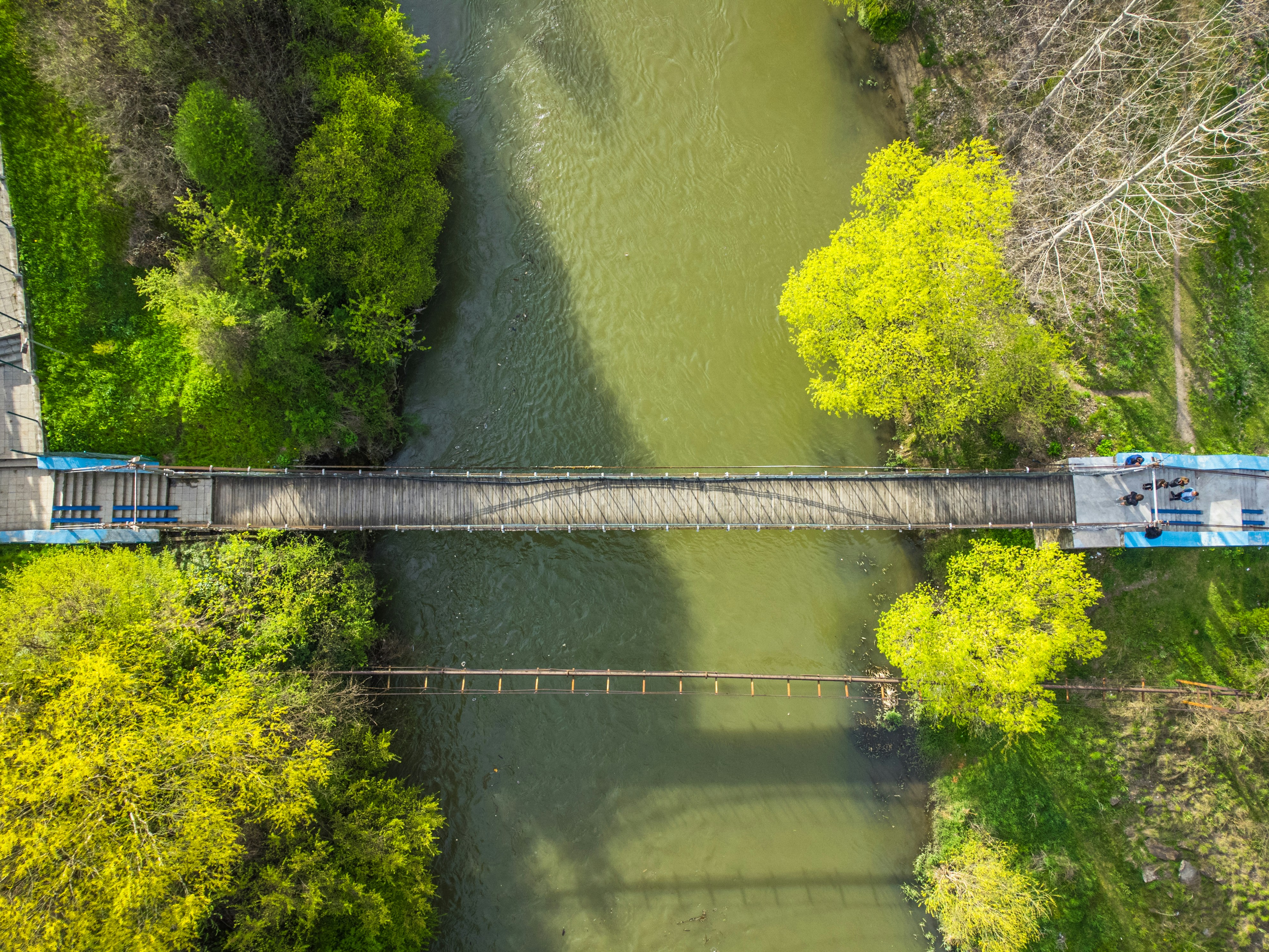a train on a bridge over a river