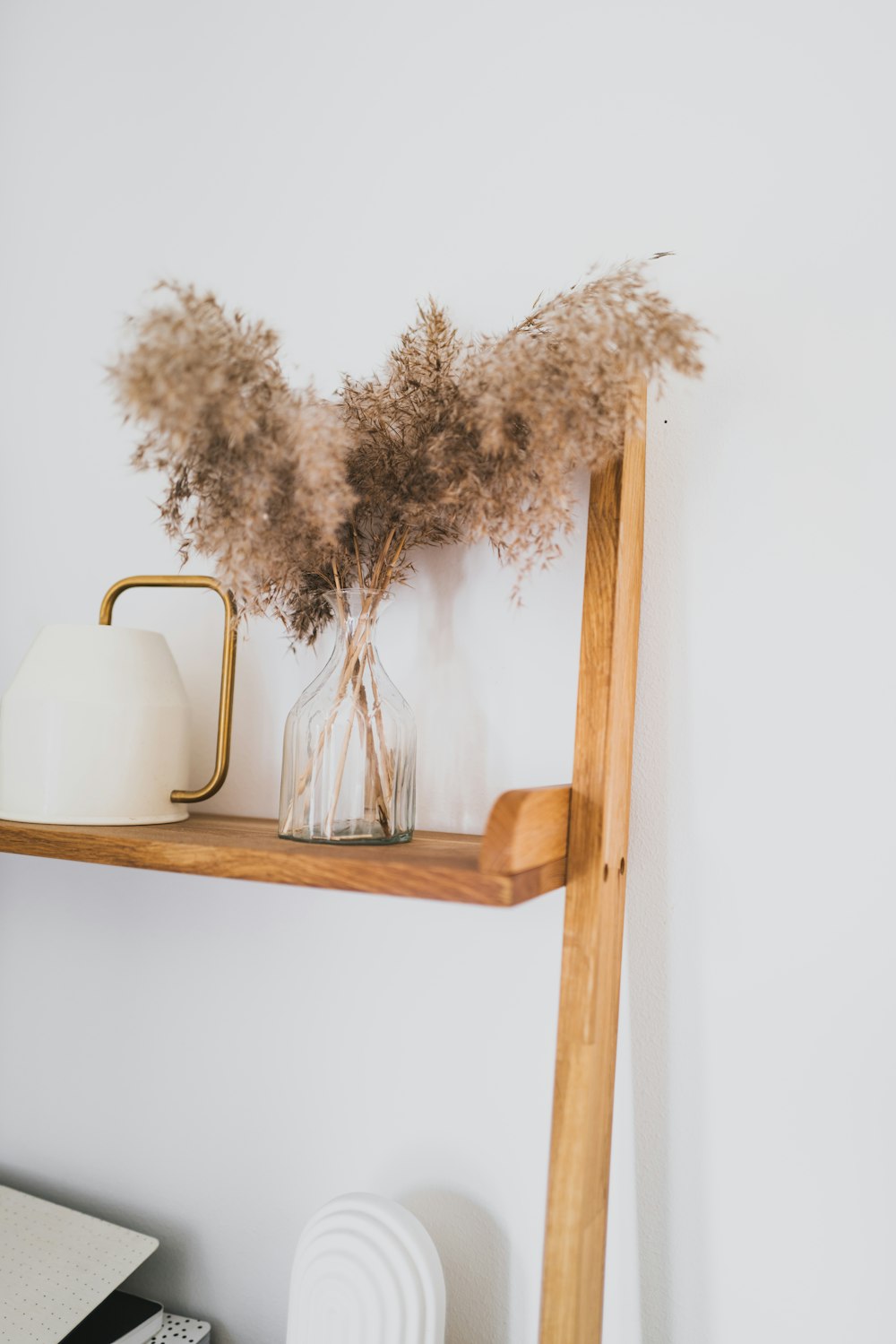 a vase with dried flowers