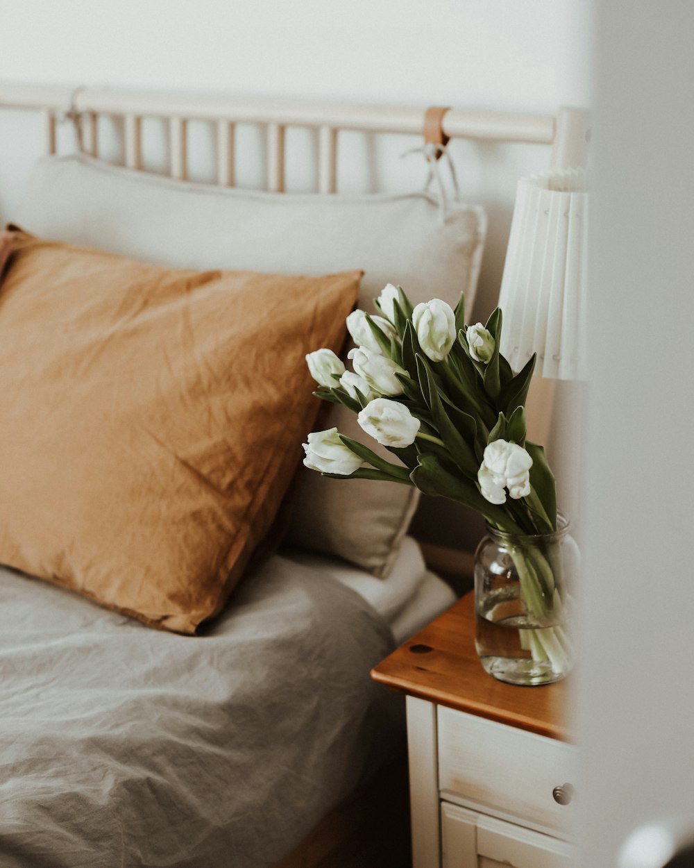 a vase of white flowers on a table