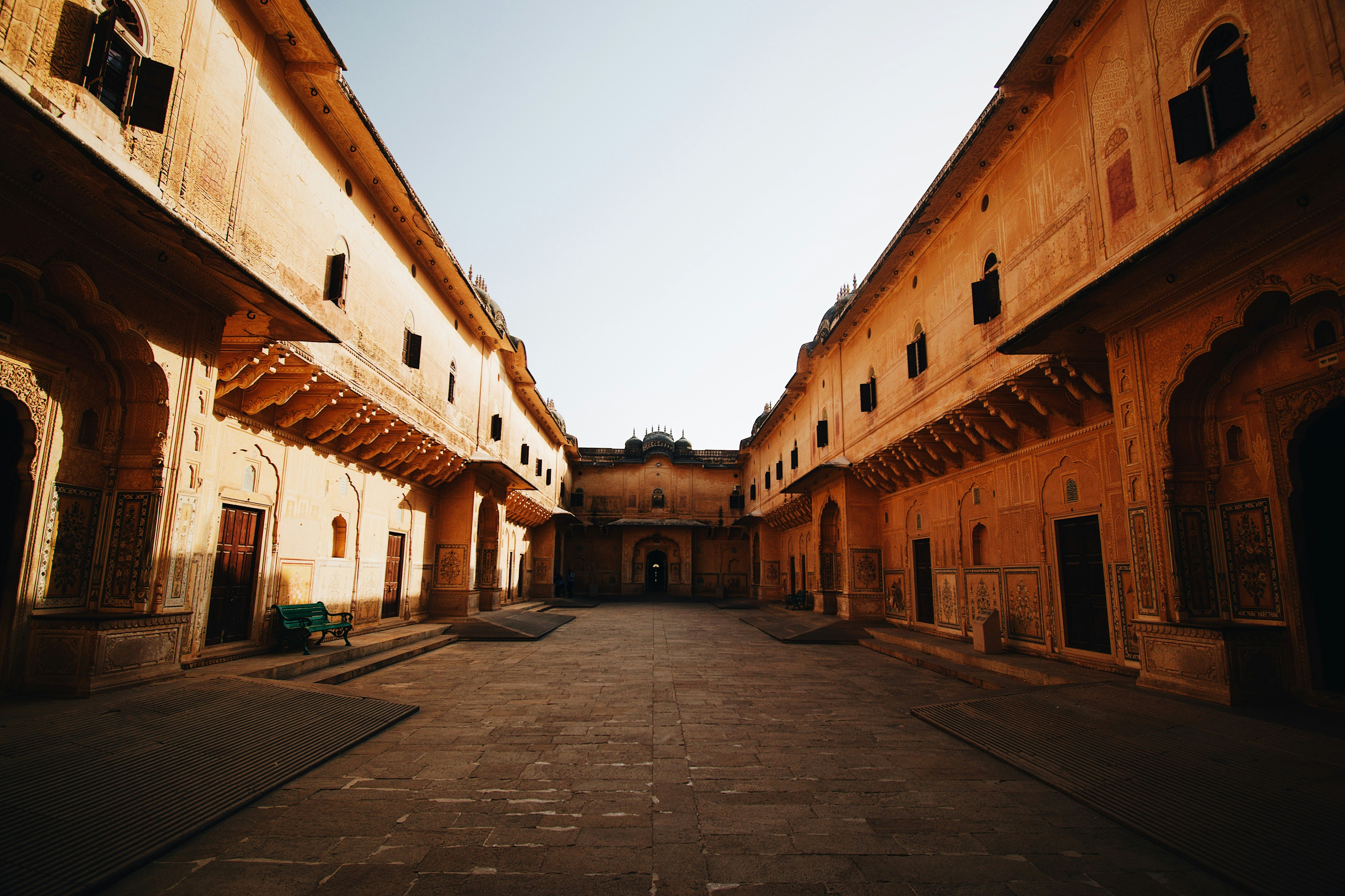 a cobblestone street between buildings