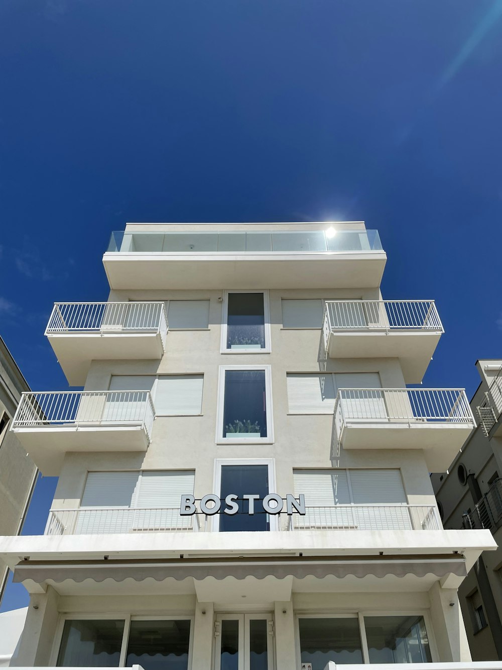 a building with balconies and a blue sky