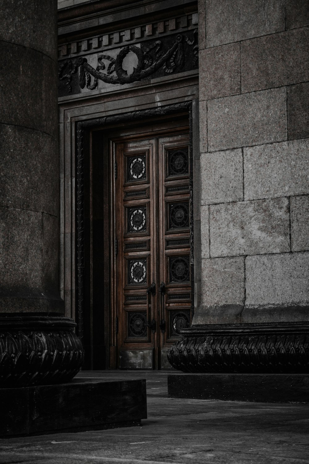 a wooden door in a stone building