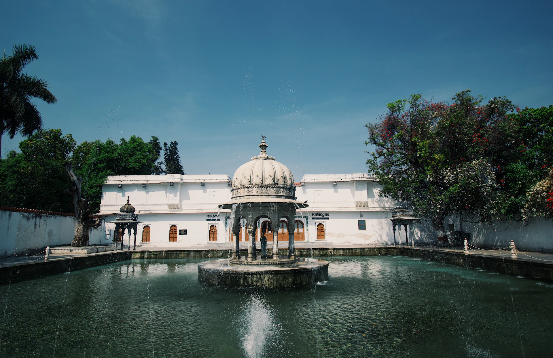 a building with a dome and a fountain in front of it