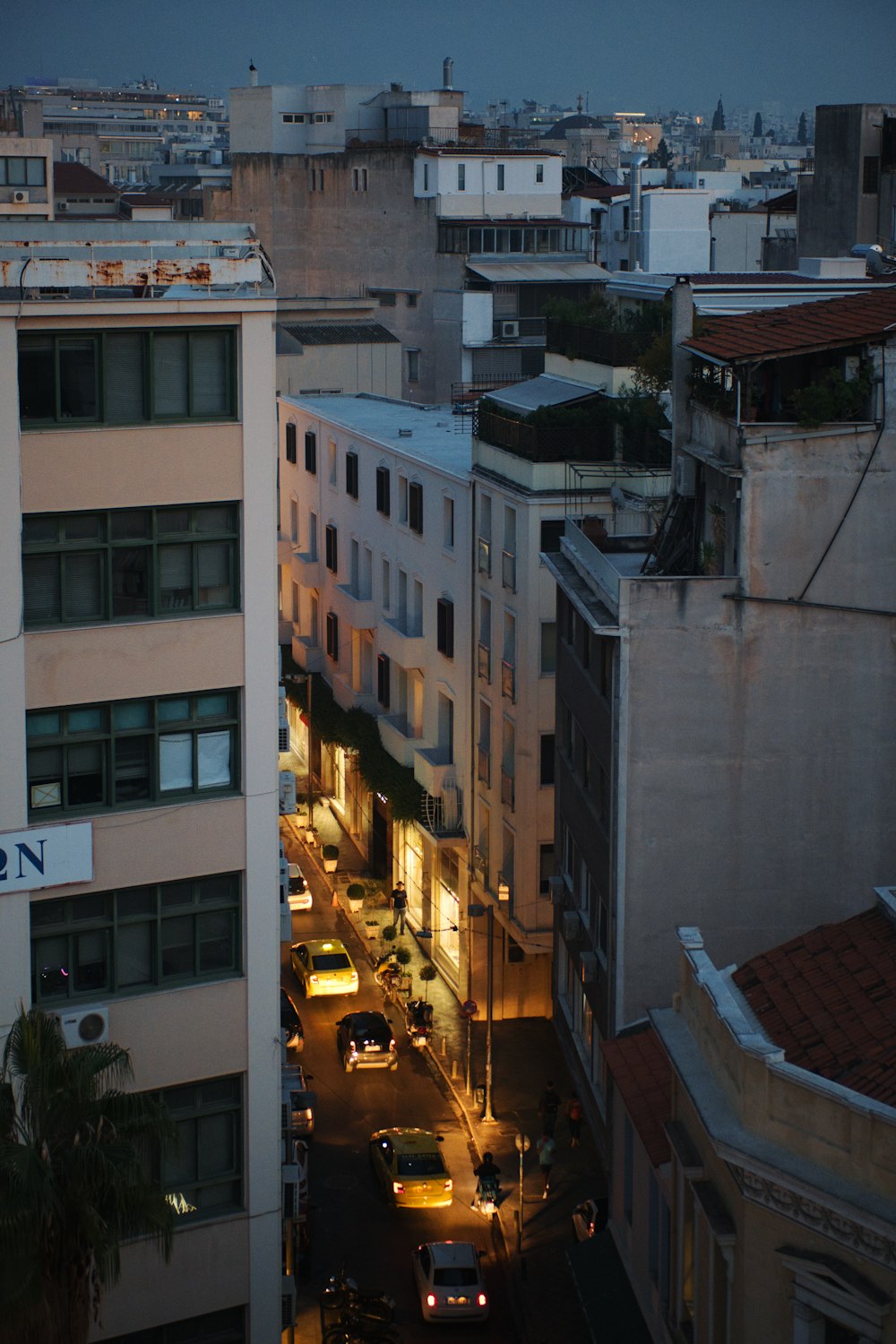 a street with cars and buildings