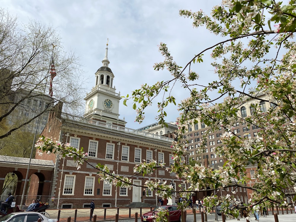 a large building with a clock tower with Maryland State House in the background