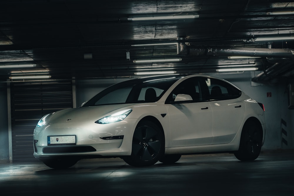 a white car parked in a garage