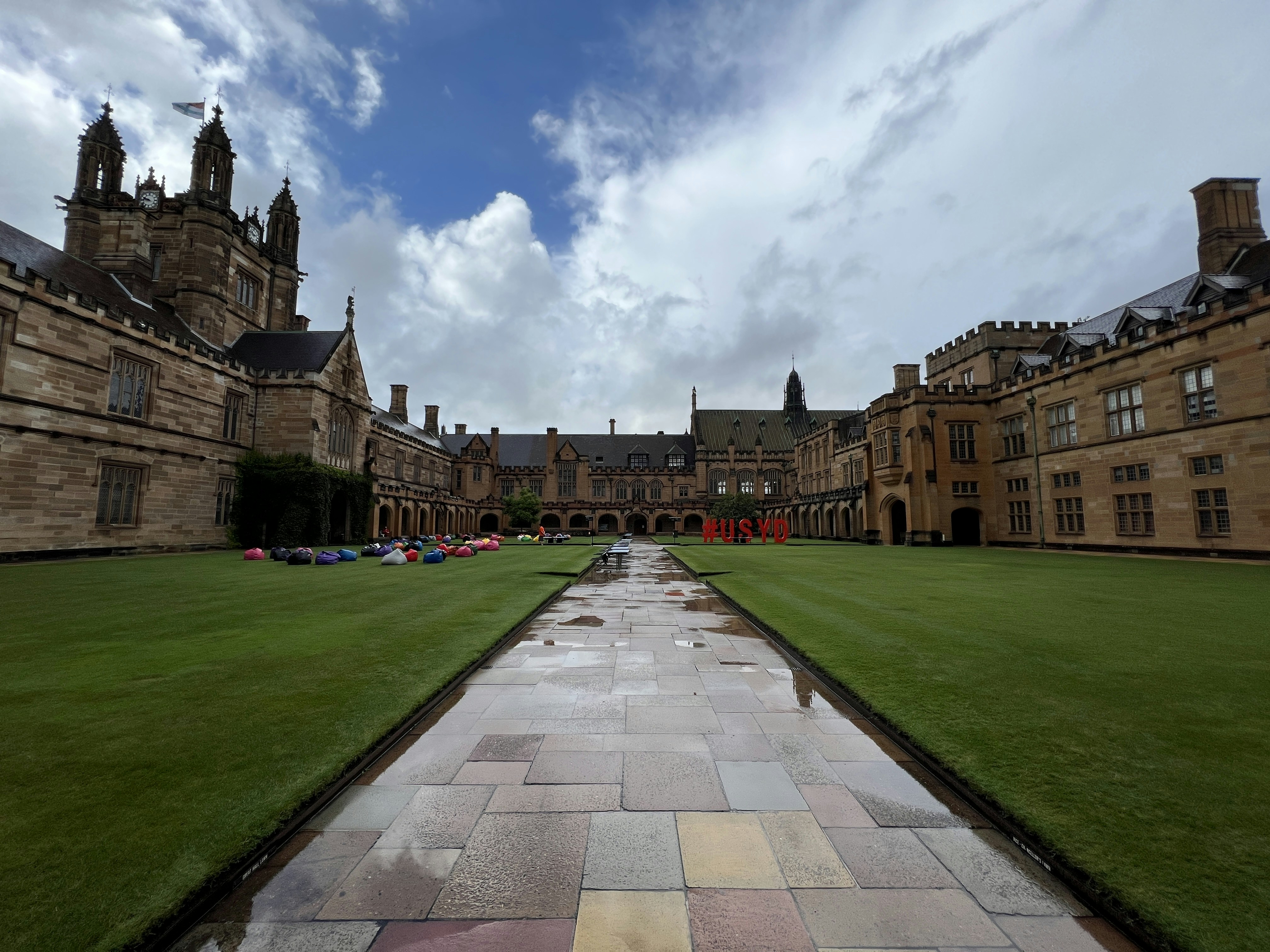 a stone pathway leading to a castle