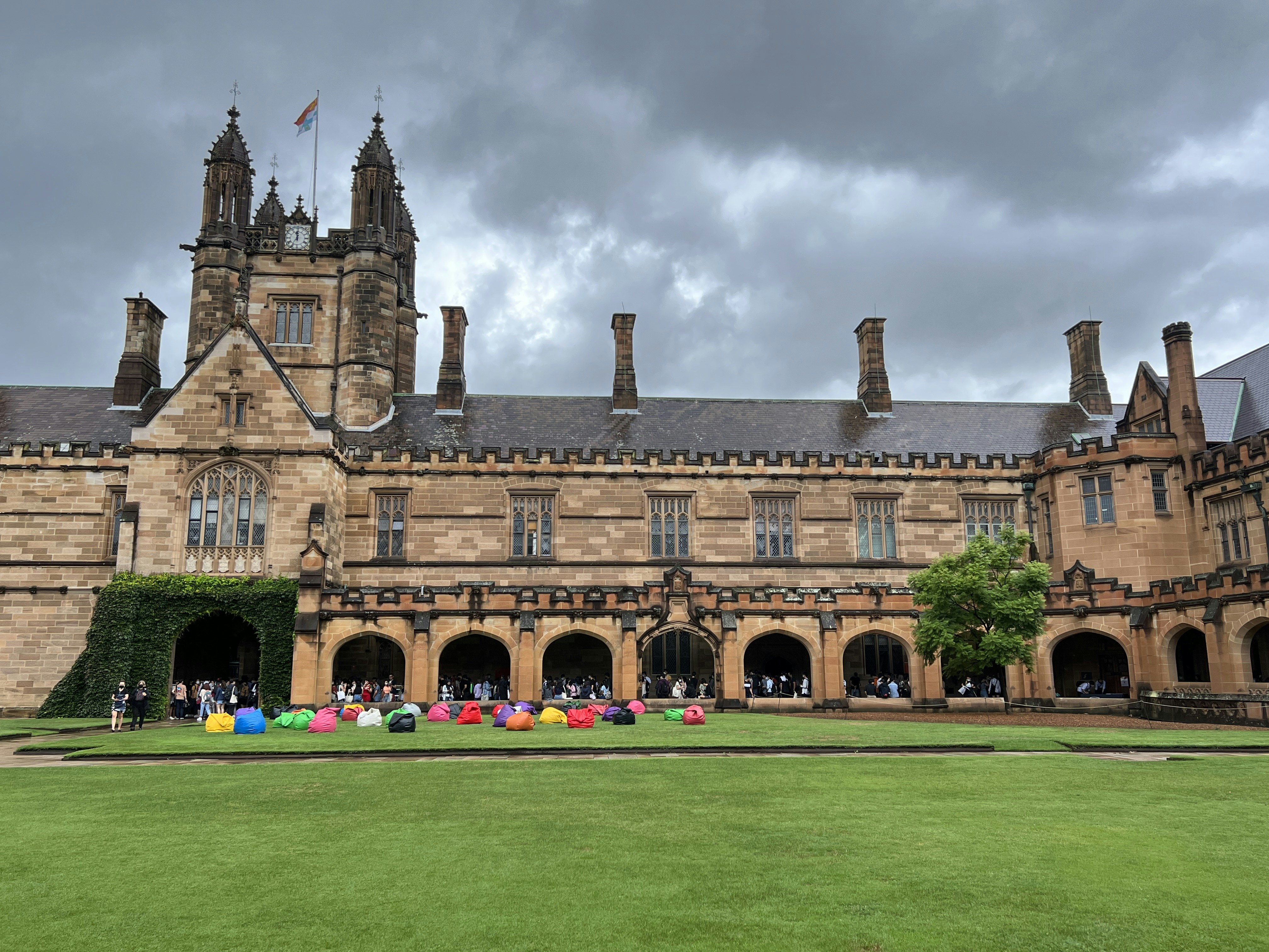 a large building with a lawn in front of it