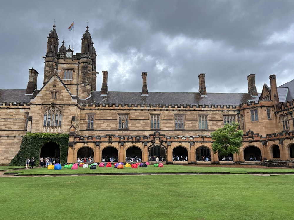 a large building with a lawn in front of it