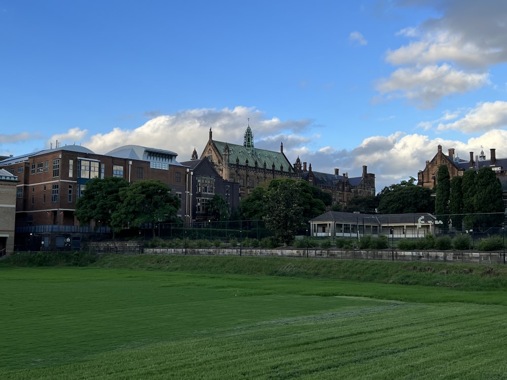 a large building with a green lawn