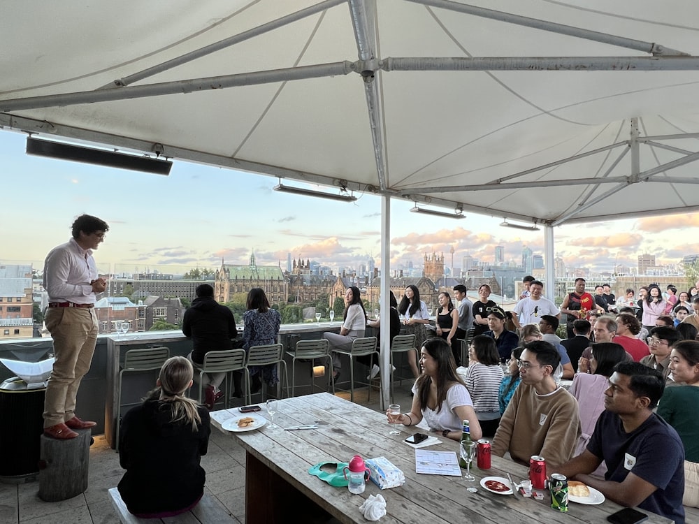 a group of people sitting at tables