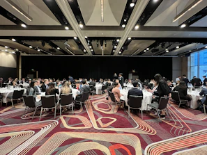 a group of people sitting at tables