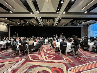 a group of people sitting at tables