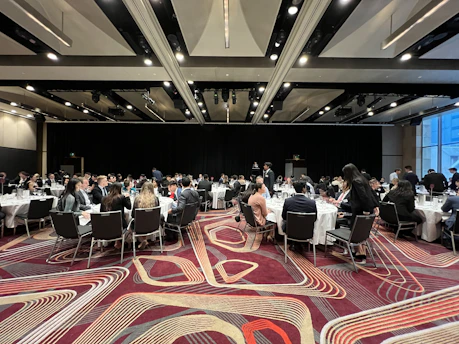 a group of people sitting at tables