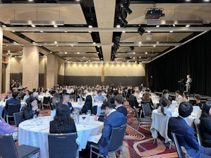 a group of people sitting at tables