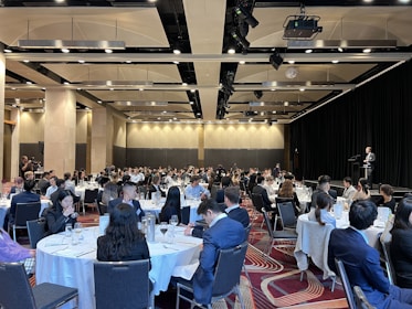a group of people sitting at tables