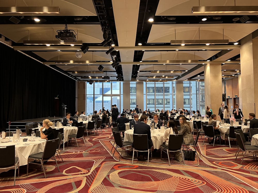 a group of people sitting at tables