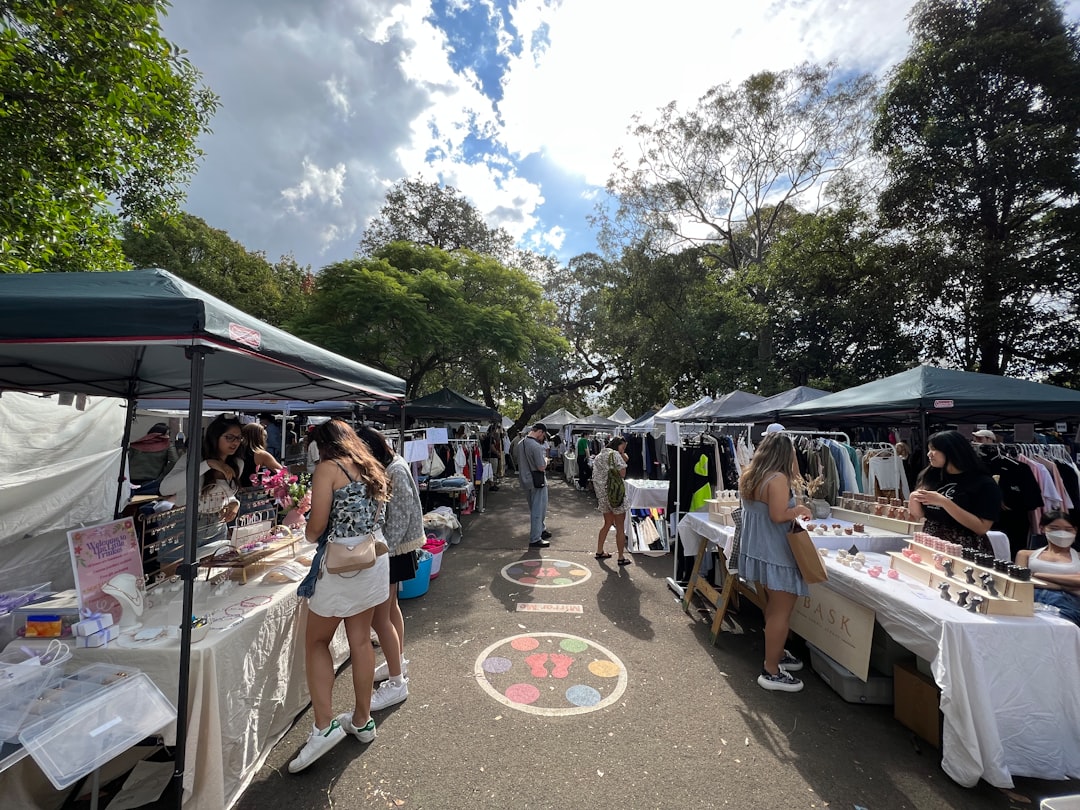 a group of people at an outdoor market,