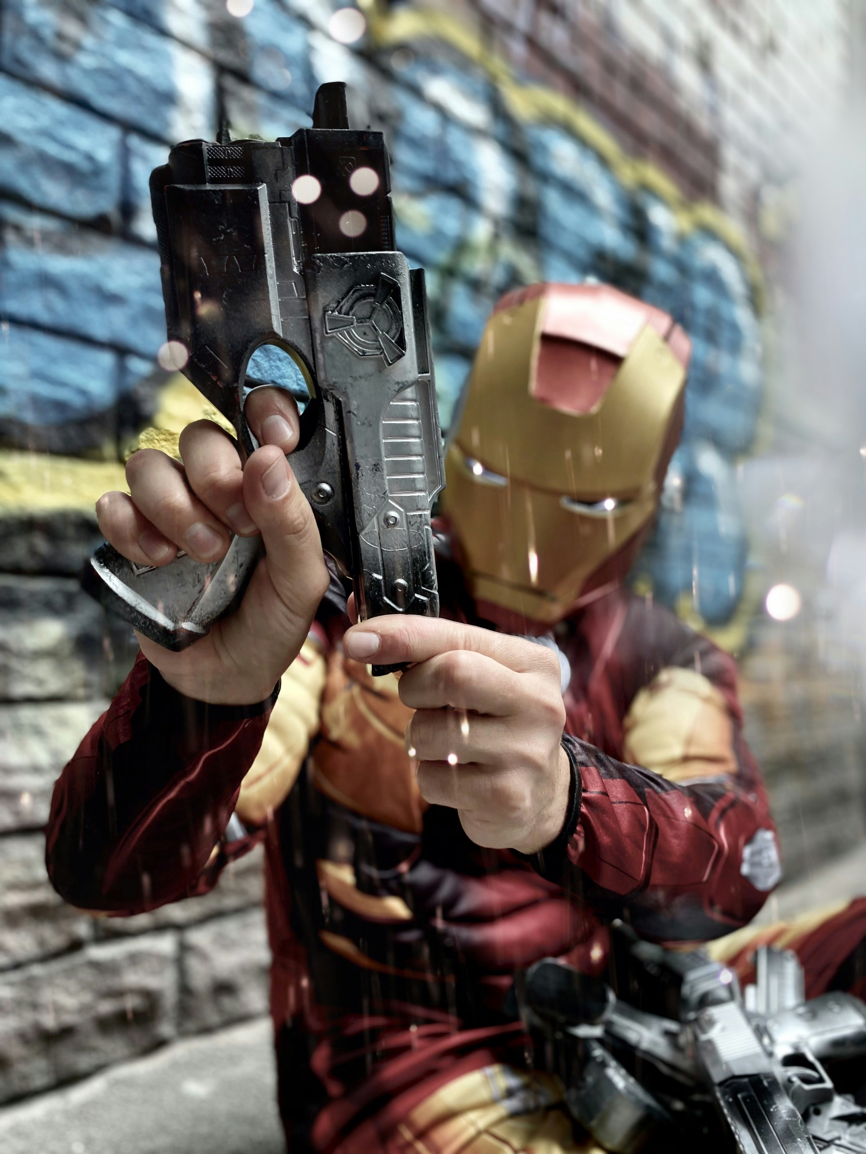 a person in a garment holding a gun