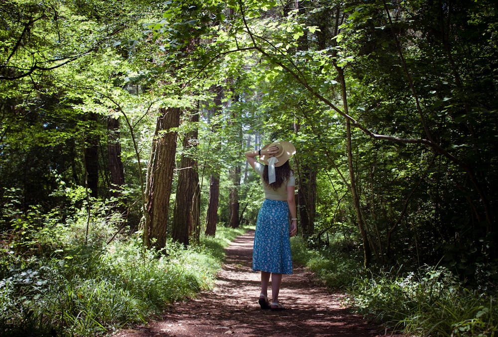 a person walking on a path in the woods