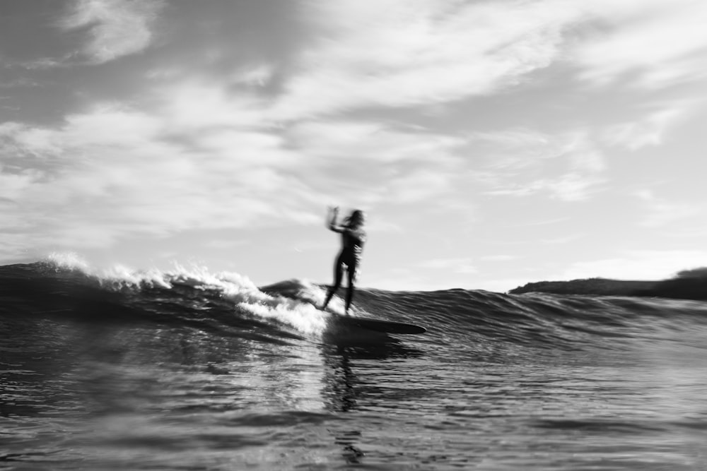 a person surfing on the waves