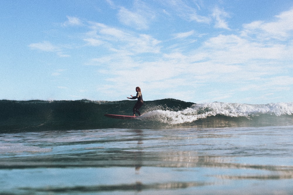 a person surfing on the waves