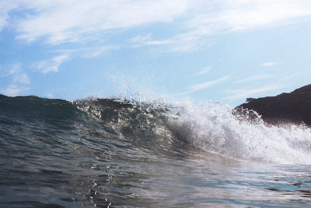 a wave crashing on a beach