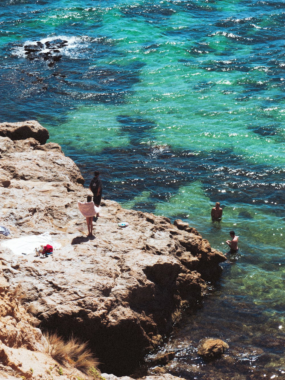 people on a rocky beach