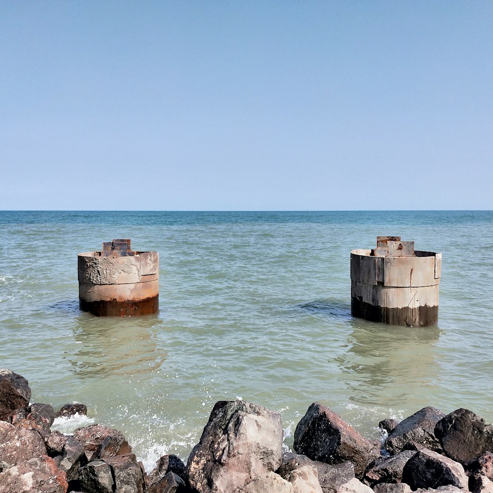 a couple of wooden structures in the water