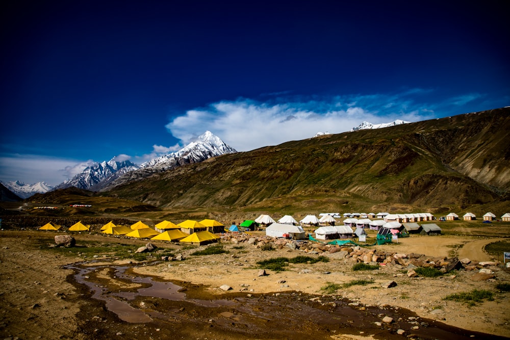 a group of tents on a beach